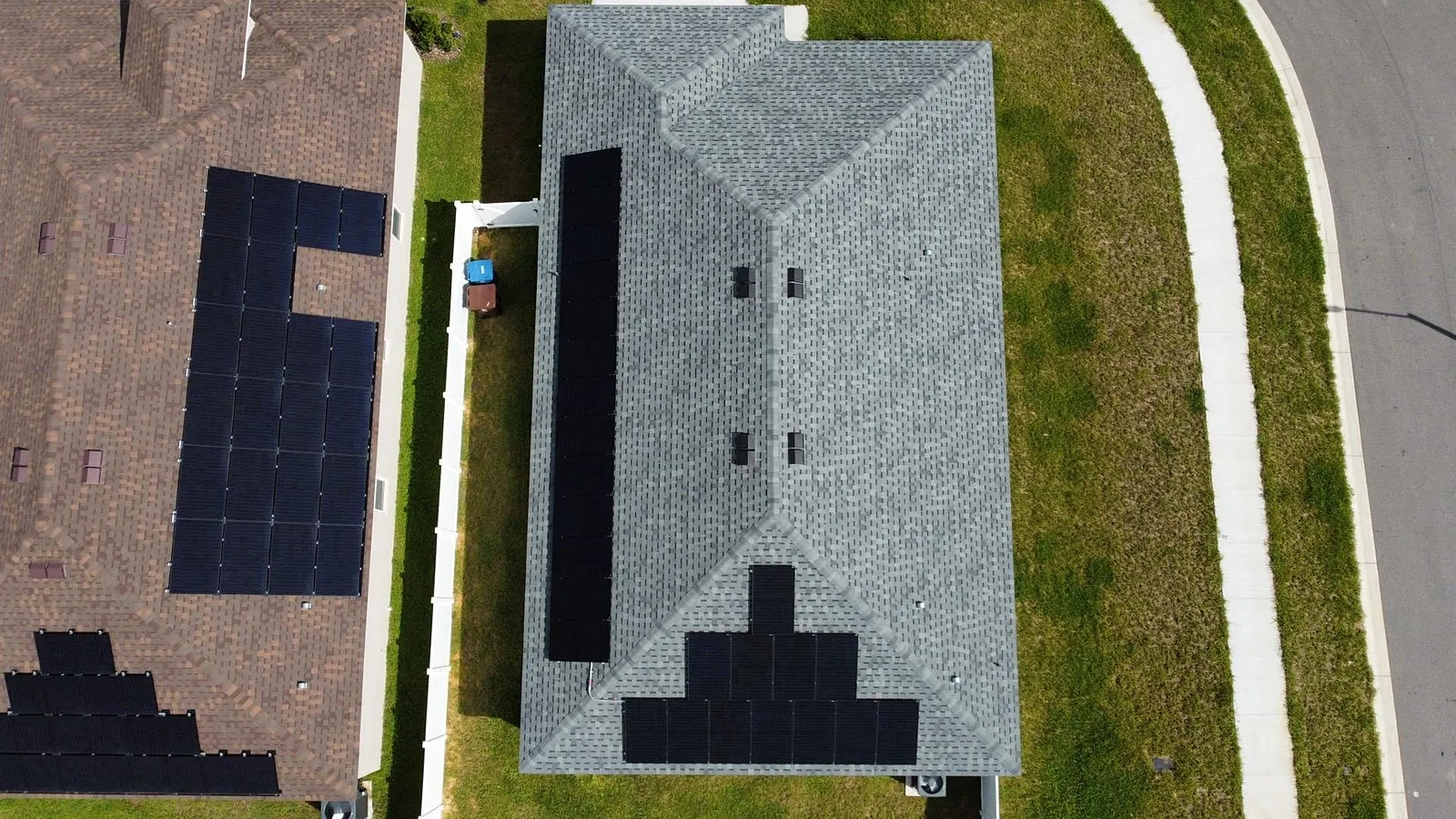 Straight-down aerial view of a solar array along a roof ridge