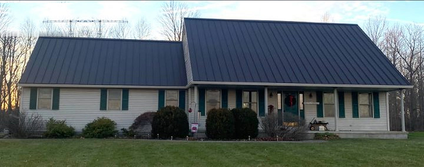 New standing-seam metal roof after HomeX reroof and solar install