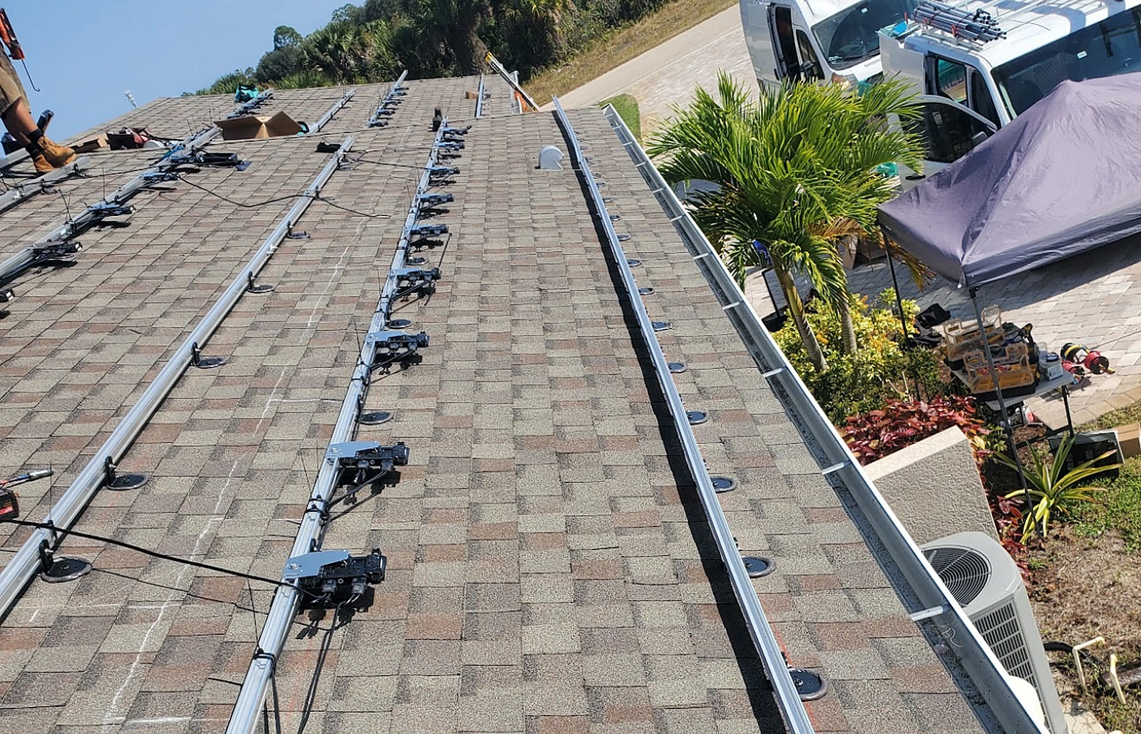Solar panel racking and mounting rails installed on a shingle roof